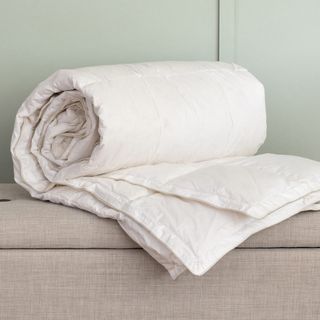 The Soak & Sleep Hungarian Goose Down Duvet rolled up