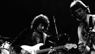 Ritchie Blackmore (left) and George Harrison perform with Deep Purple at the Entertainment Centre in Sydney, Australia on December 12, 1984