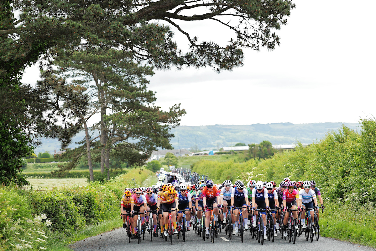 Picture by Alex Whitehead/SWpix.com - 08/06/2022 - Cycling - The Womenâ€™s Tour 2022 - Stage Three - Tewkesbury to Gloucester, England - The peloton rolling through the Gloucestershire countryside