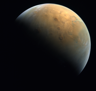 The UAE's Hope spacecraft's first photo of Mars from orbit, captured on Feb. 10, 2021.