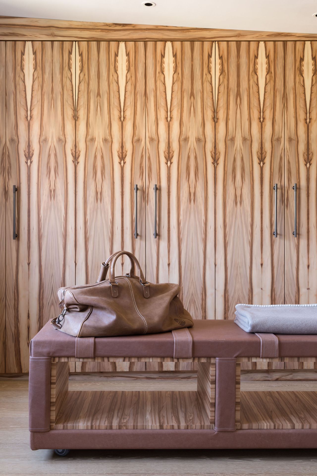 Inside of a tree wooden cupboards, brown and wooden bench