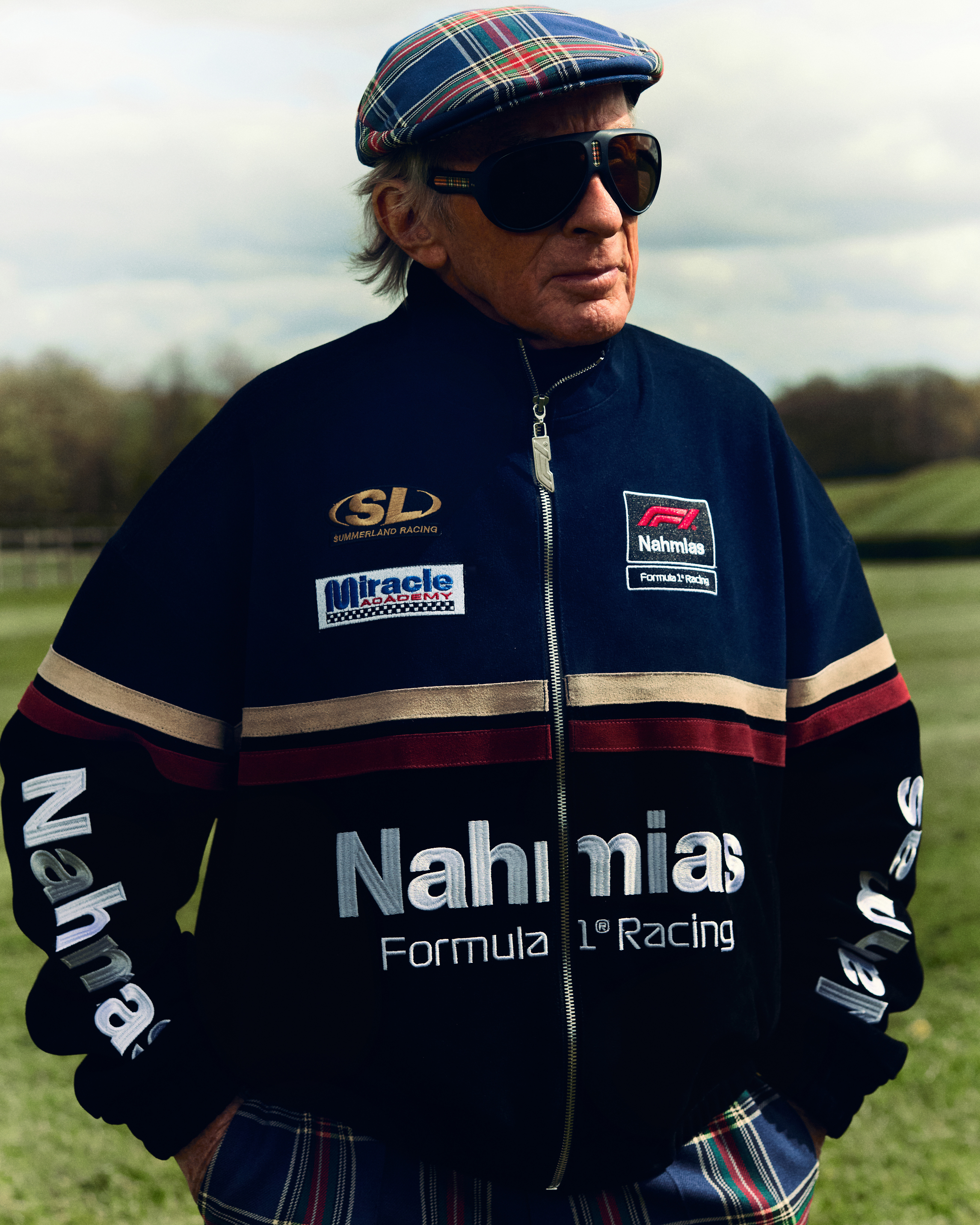 A photo of Sir Jackie Stewart wearing the Nahmias x Formula 1 collection.