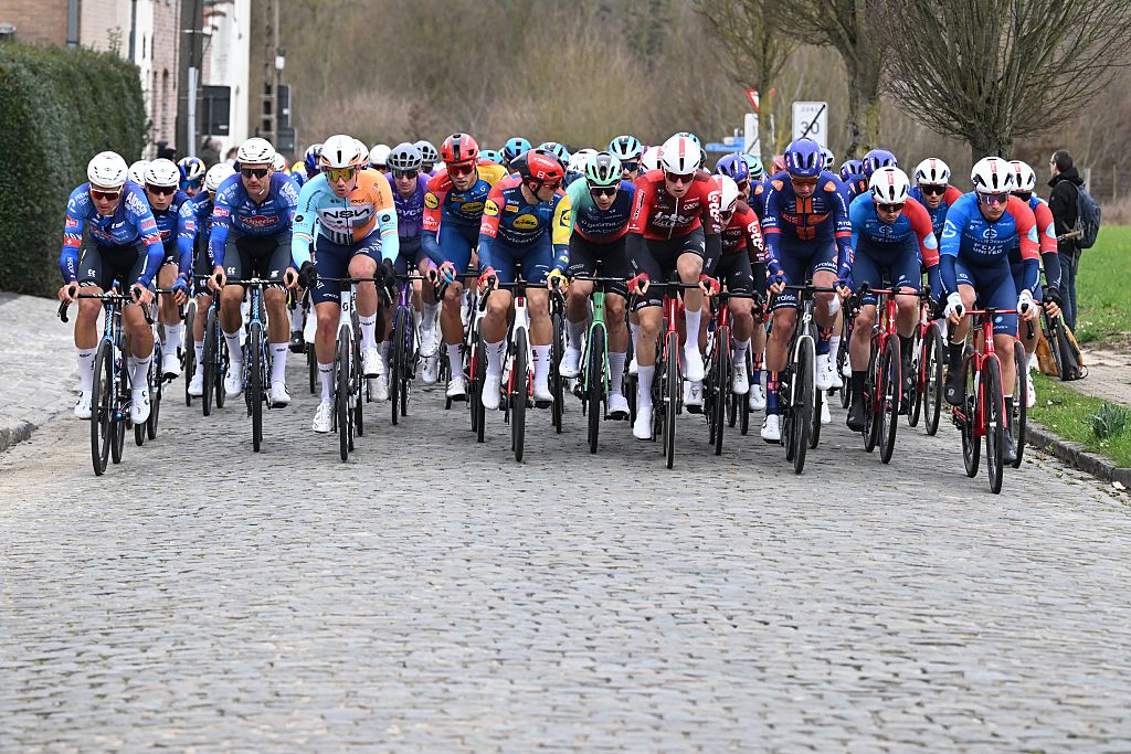 The pack of riders pictured in action during the 78th edition of the men elite race of the Kuurne-Brussels-Kuurne one day cycling race, 195 km from Kuurne to Kuurne via Brussels, Sunday 01 March 2026. BELGA PHOTO POOL THOMAS SISK (Photo by POOL THOMAS SISK / BELGA MAG / Belga via AFP)