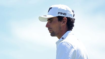 Joaquin Niemann wearing a white Ping cap and white polo shirt during the US Open