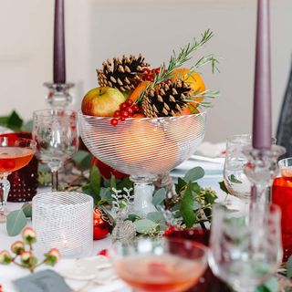 Christmas table decorational centrepiece with orange colours and fruits