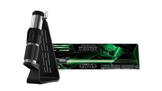 A Star Wars The Black Series Yoda Premium Force FX Elite Lightsaber, next to its box.