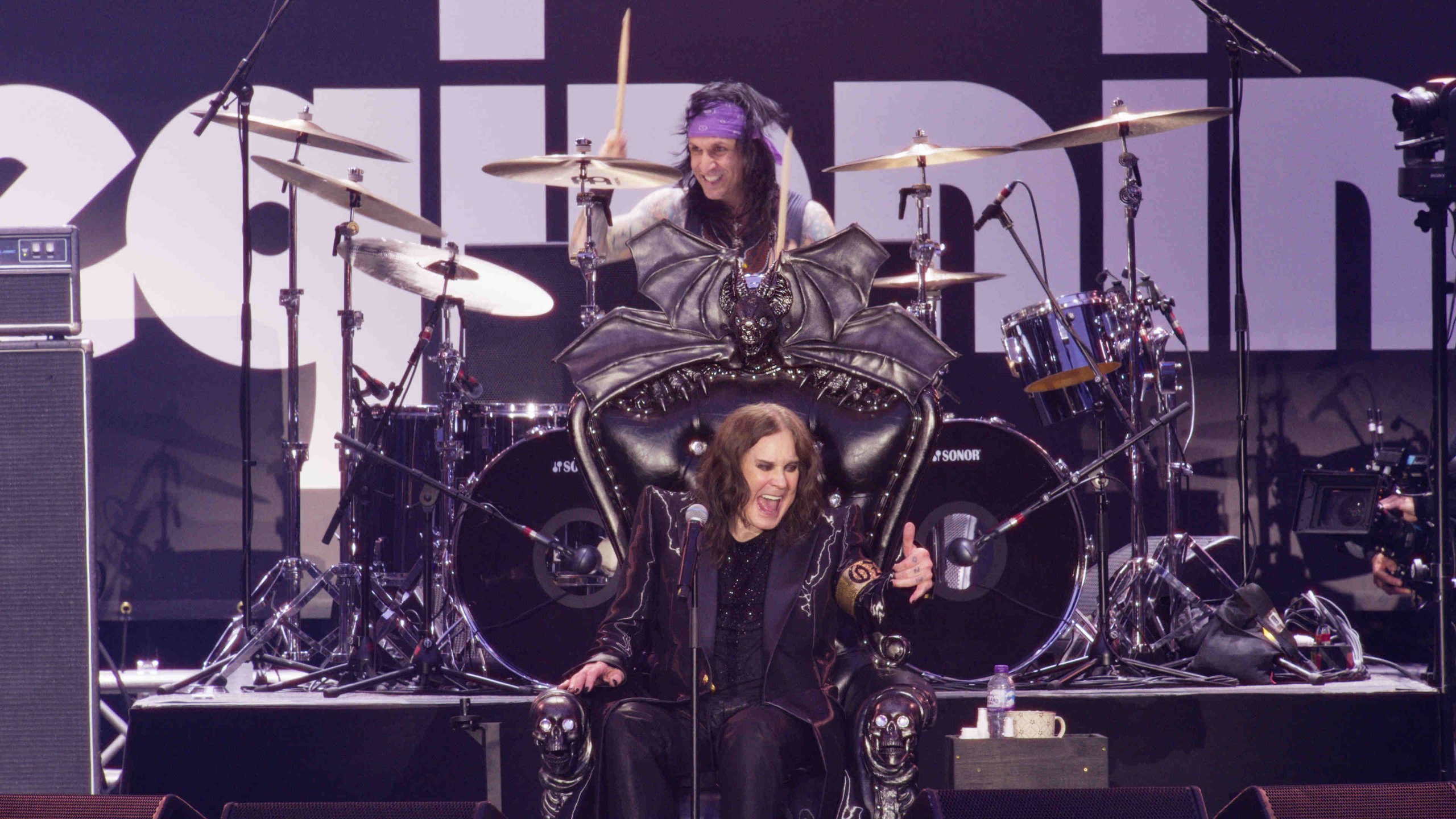 Ozzy Osbourne performing onstage at the Back To The Beginning show at Villa Park in July 2025