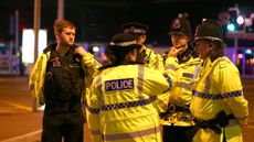 Emergency services arrive close to the Manchester Arena on 23 May 2017 