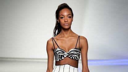 Model wearing zebra stripes, on the catwalk