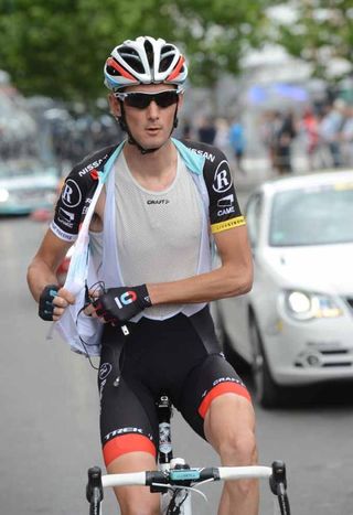 Frank Schleck (RadioShack-Nissan) adjusts his radio.