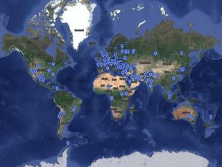 a map of earth with dozens of pins dropped to indicated locations across many countries.
