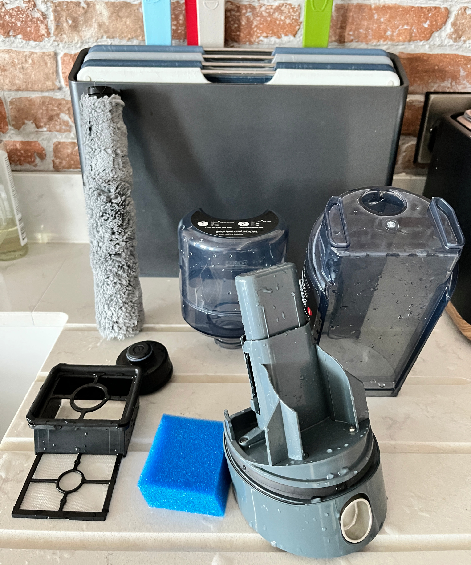 components of beldray all in one floor cleaner on draining board drying