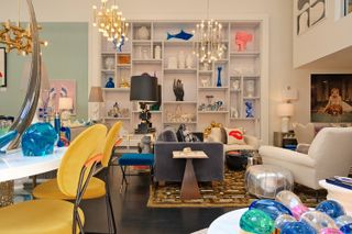 Jonathan Adler's store with yellow chairs and shelving filled with objet