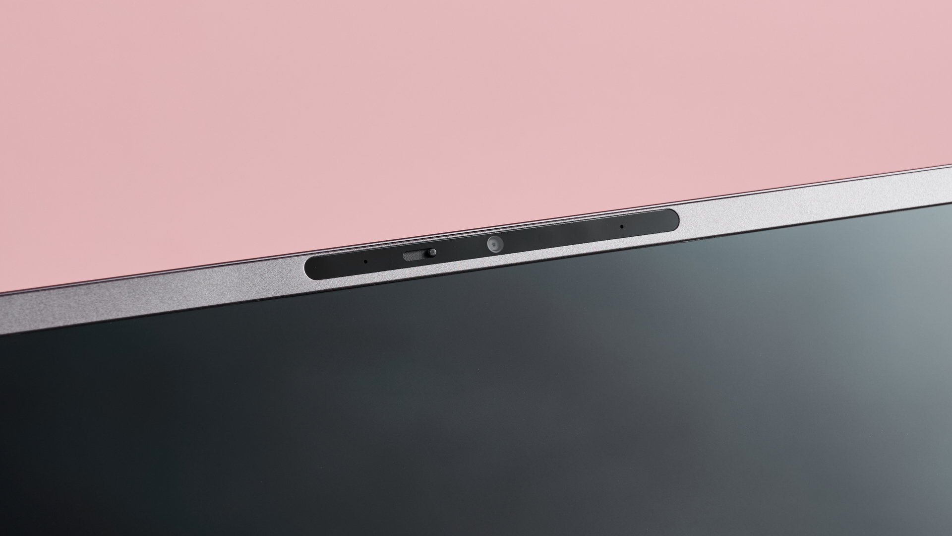Close-up of camera on Acer Aspire 16 AI on pink background