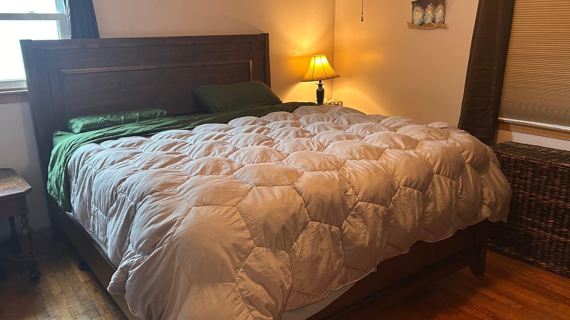 Sijo Airyweight Eucalyptus sheet set on the bed in a brightly lit room with a comforter on top
