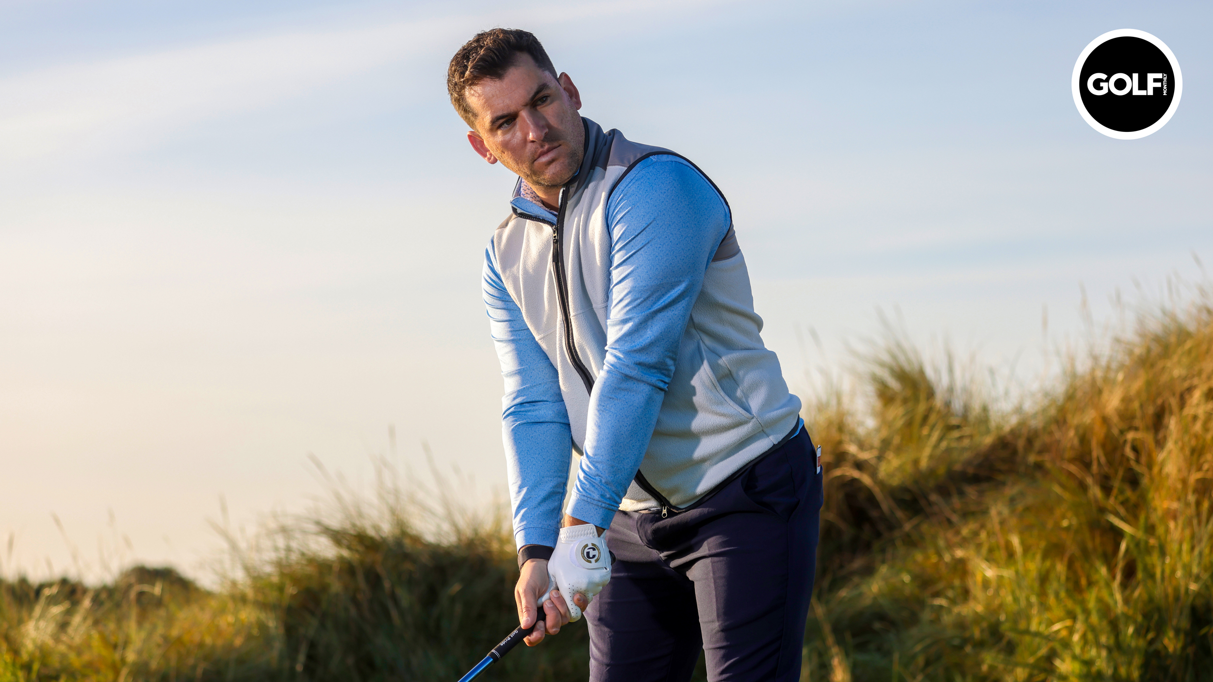 A golfer lines up a tee shot