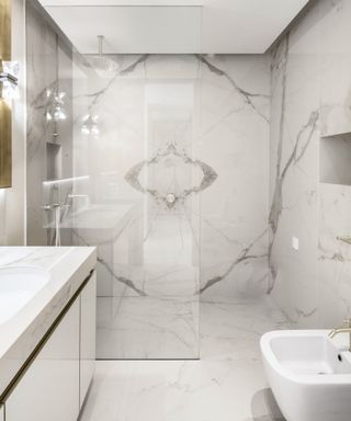 grey and white marble effect bookmatched wall in shower enclosure