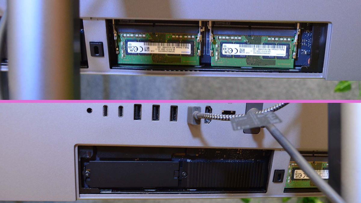 An HP Envy 34 on a desk in front of a plant