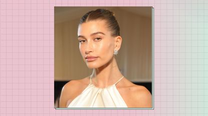 Hailey Bieber with glowing foundation/ and highlighter at the Met Gala 2022/ in a pink and green background