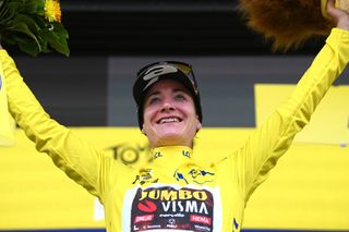 BARSURAUBE FRANCE JULY 27 Marianne Vos of Netherlands and Jumbo Visma Women Team celebrates winning the yellow leader jersey on the podium ceremony after the 1st Tour de France Femmes 2022 Stage 4 a 1268km stage from Troyes to BarSurAube TDFF UCIWWT on July 27 2022 in BarsurAube France Photo by Dario BelingheriGetty Images