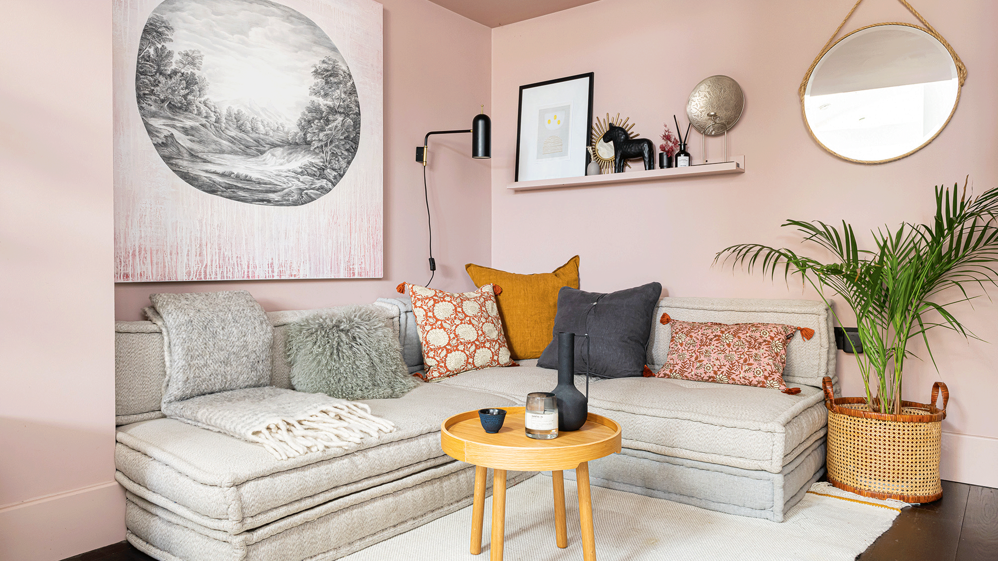 small white living room with corner sofa and shelving unit plus rug