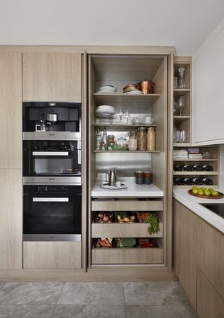 minimalist kitchen with oak pantry