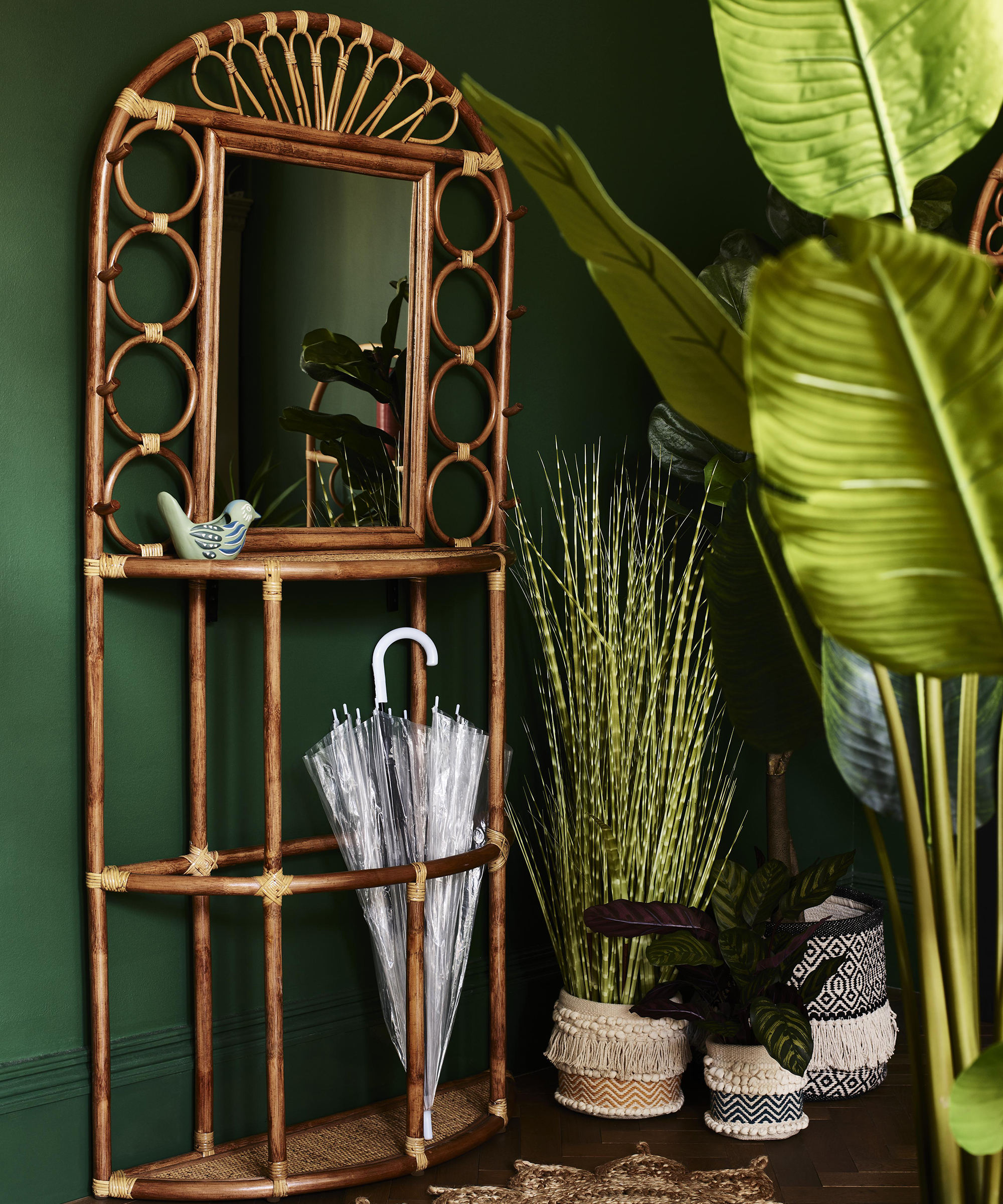 Hallway ideas by Oliver Bonas with rattan console table with built-in mirror and umbrella storage