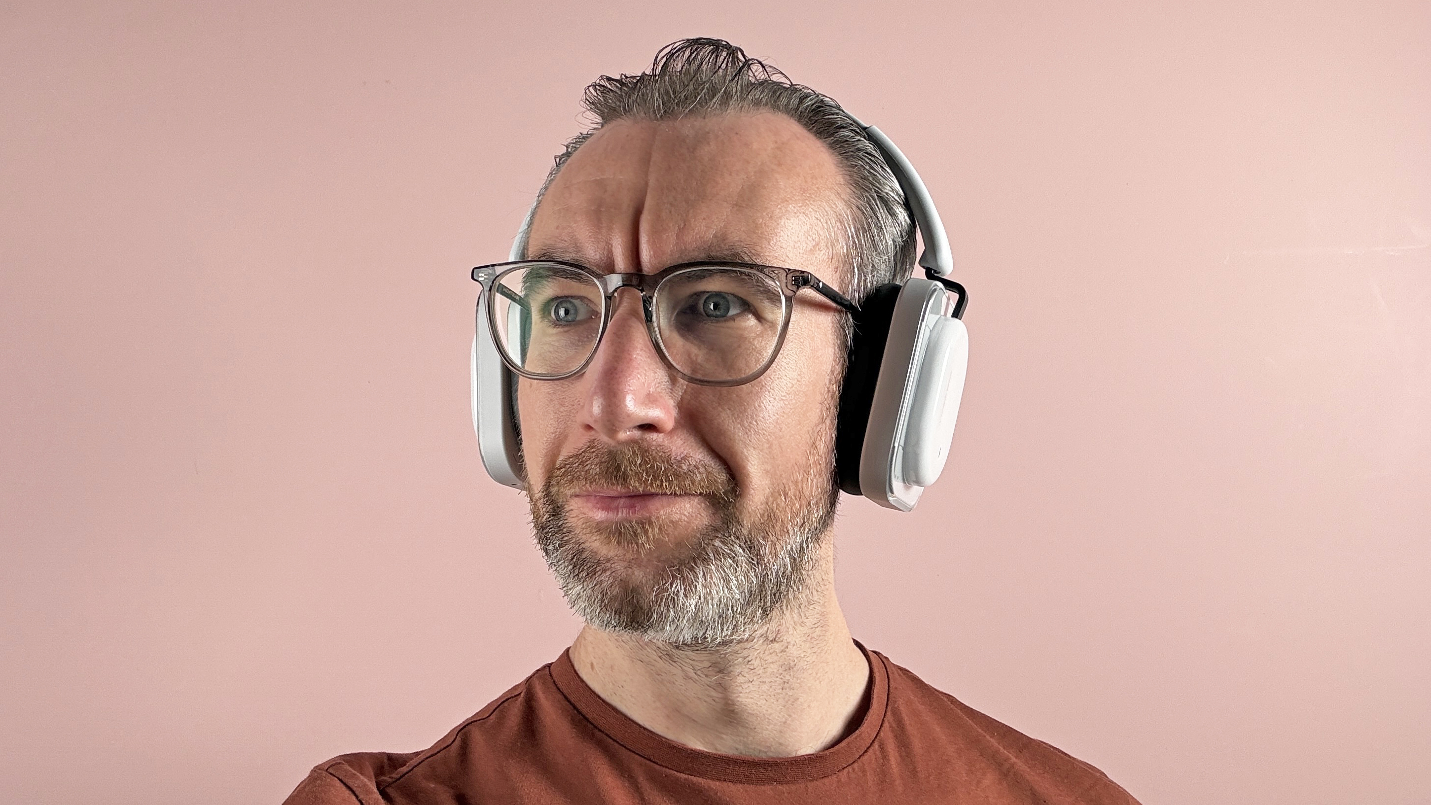 The Nothing Headphone (a) worn on a man's head