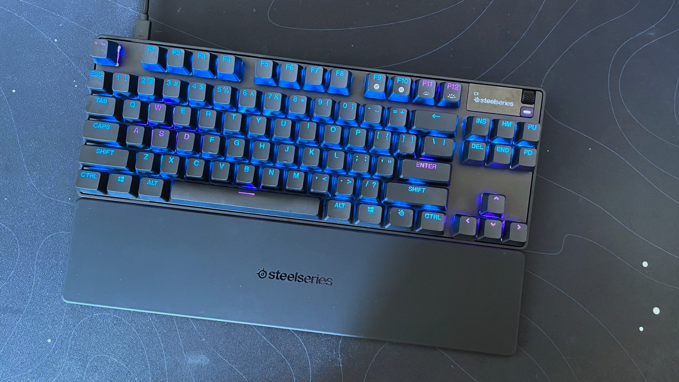 The SteelSeries Apex Pro Gen 3 TKL seen from above on a black desk mat