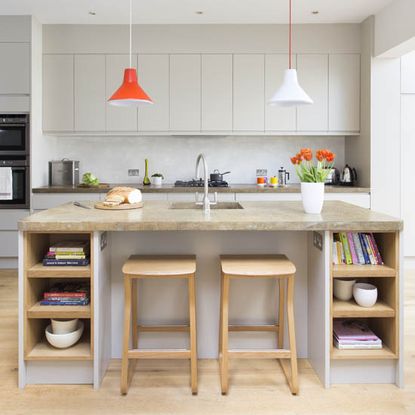 kitchen room with wooden flooring and white kitchen cabinets