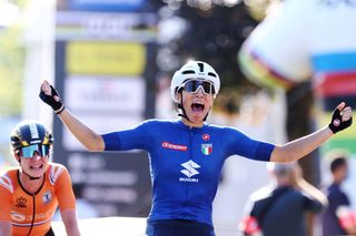 Italys Elisa Balsamo R celebrates as she crosses the finish line to win ahead of secondplaced Netherlands Marianne Vos during the womens elite cycling road race 1577km from Antwerp to Leuven on the seventh day of the Flanders 2021 UCI Road World Championships on September 25 2021 in Leuven Photo by KENZO TRIBOUILLARD AFP Photo by KENZO TRIBOUILLARDAFP via Getty Images