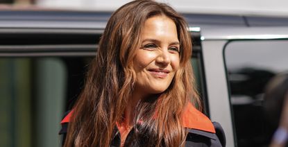 katie holmes smiles at the paparazzi 