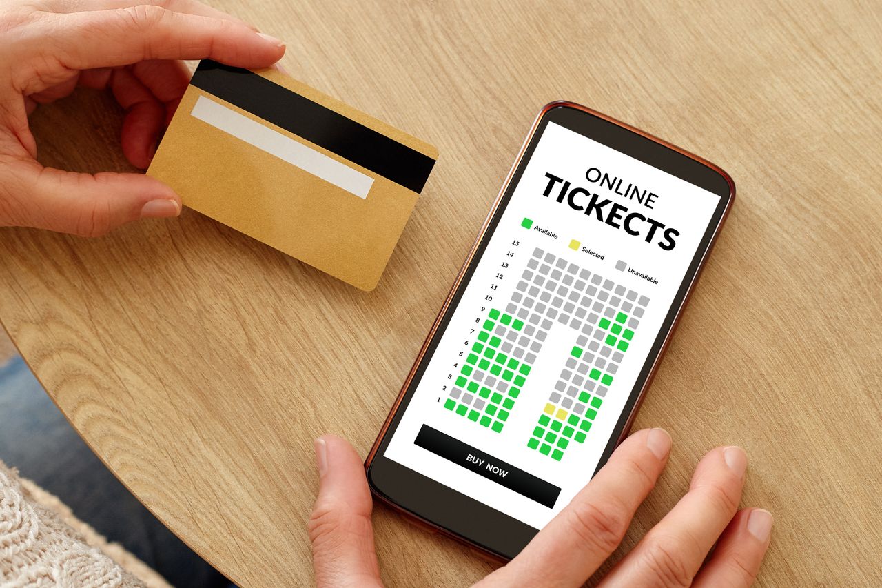 A person purchasing online tickets. 