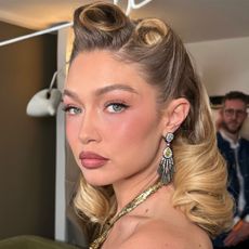 Gigi Hadid with victory roll hairstyles at the Met Gala 2025