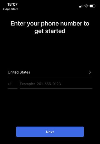 A screenshot of the phone number entry page in the Signal iOS app.