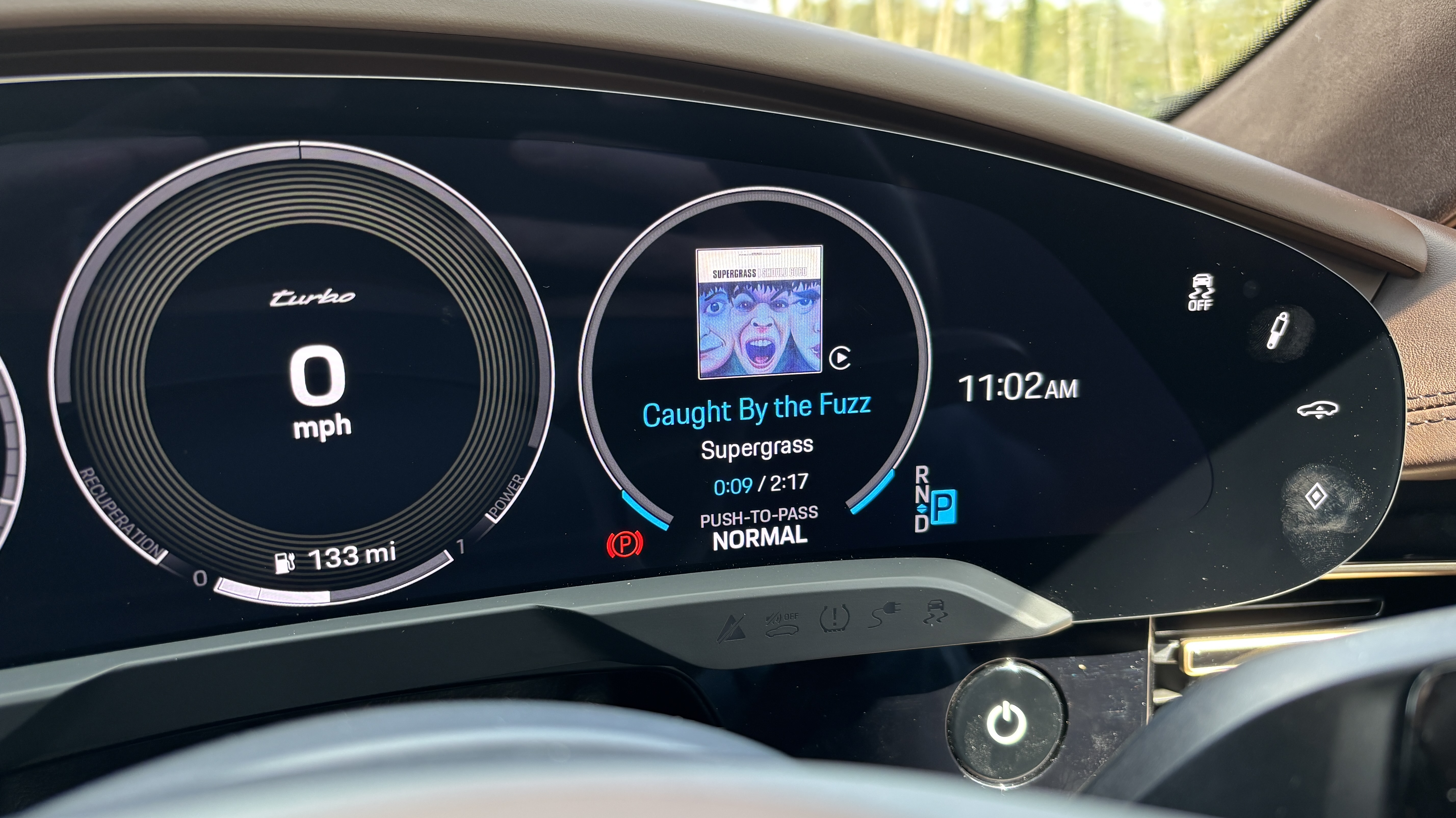 Album artwork shown on the drivers display in the Porsche Taycan