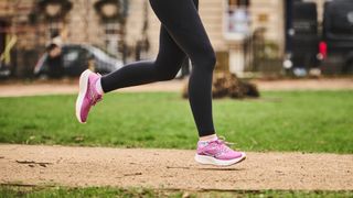 Woman wearing Saucony Ride 17 running shoes