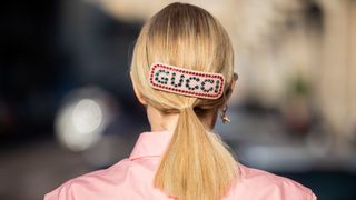 Woman wearing a Gucci hair slide