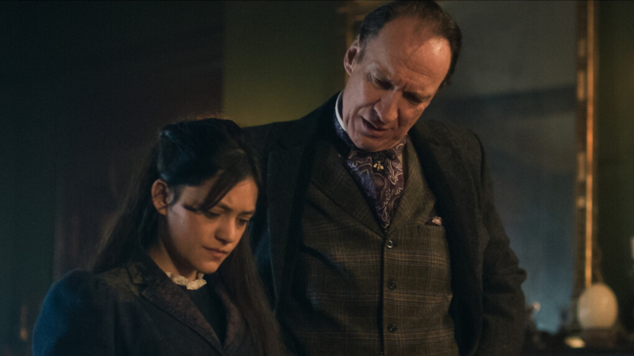 David Thewlis' Sherlock Holmes and Blu Hunt's Amelia Rojas inspecting document in Sherlock & Daughter