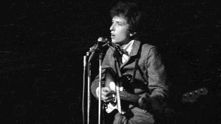 Bob Dylan performing onstage in 1966