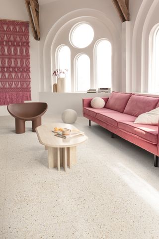 Terrazzo Luxury Vinyl Tiles in a modern church conversion with a large pink sofa