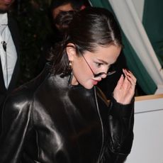 Selena Gomez leaving Brooks Nader's birthday dinner at San Vicente Bungalows in West Hollywood, California on February 7 wearing a Khaite leather jacket and carrying a Prada leather bag