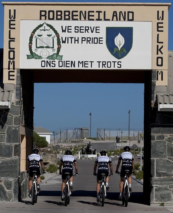 Team Bulls 1 and 2 ride through the entrance to Robben Island.