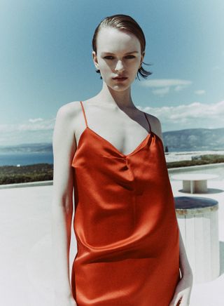 Woman in red silk dress