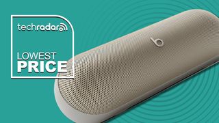 Beats Pill in Champagne on blue background with TR&#039;s &#039;lowest price&#039; badge 