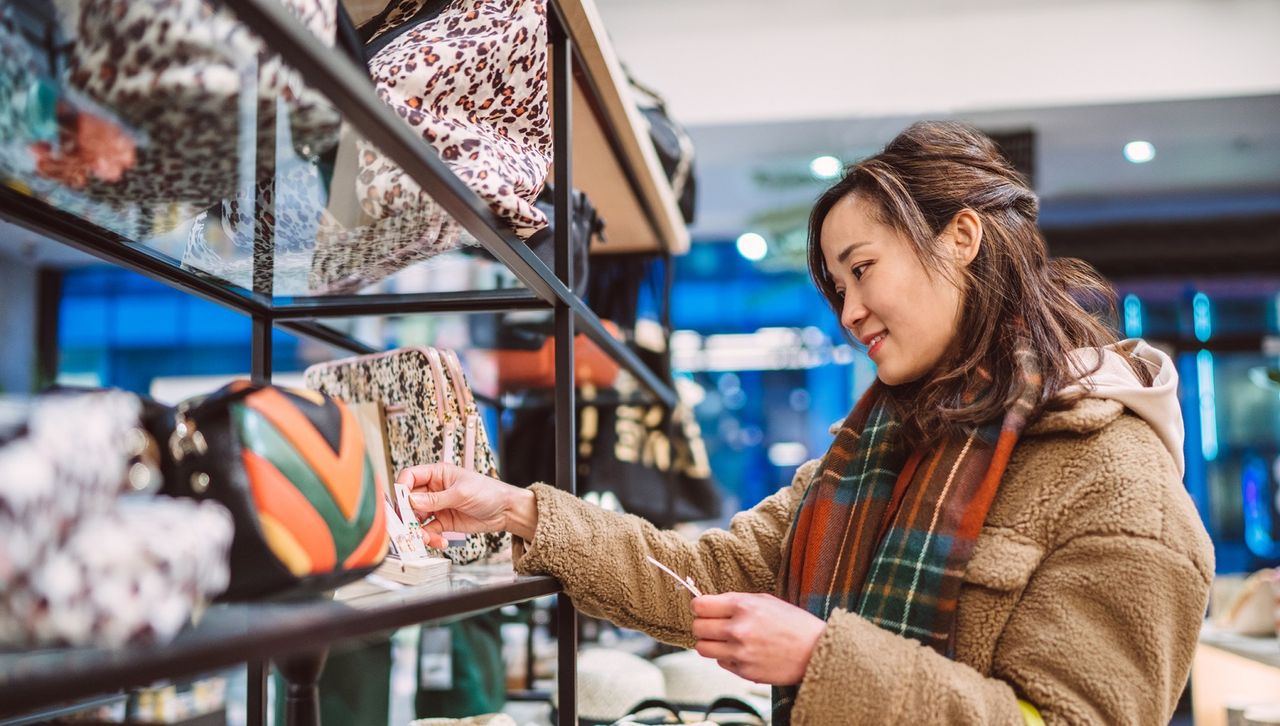 Woman shopping for accessories in a store.