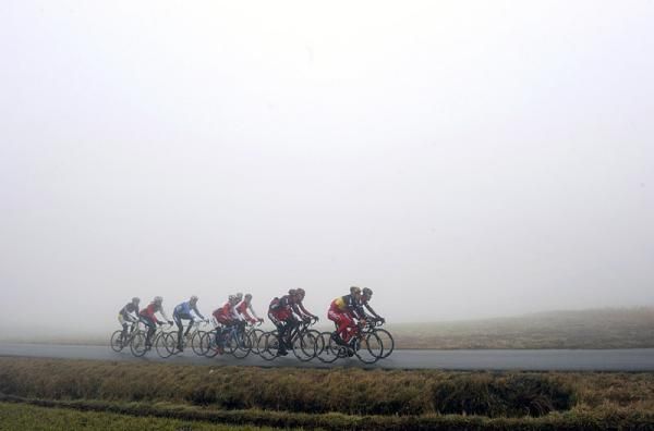 BMC riders preview the Omloop Het Nieuwsblad course on a foggy day in Belgium.