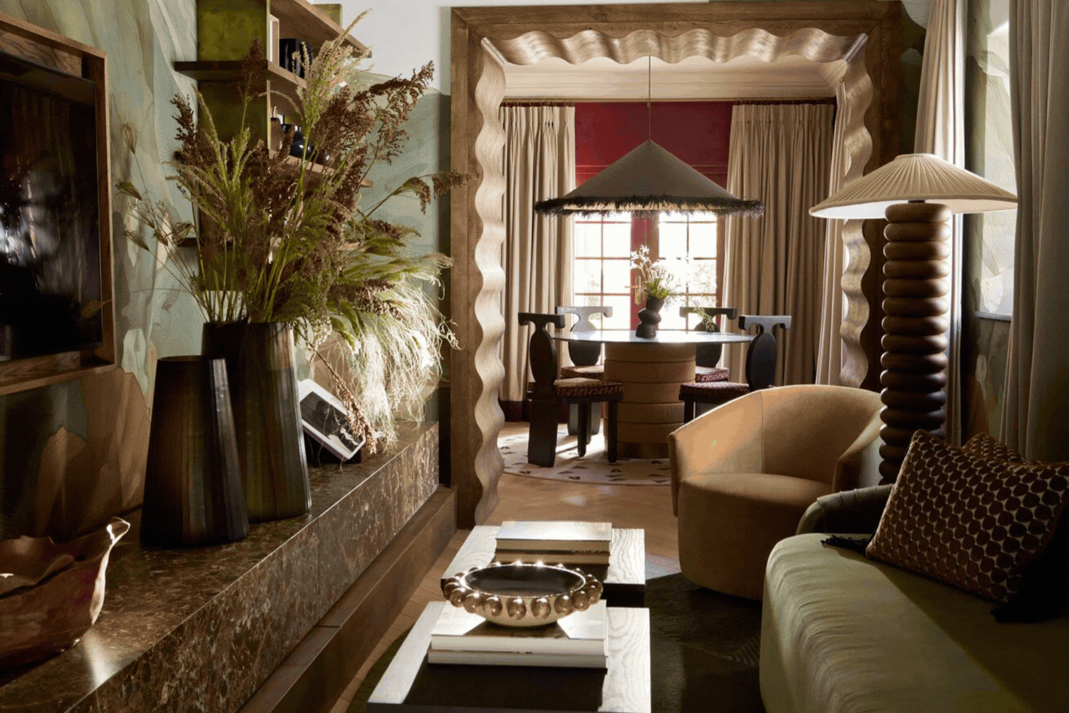 A rotating gif showcasing the artsy interiors, filled with hanging or mural-painted artworks, sculptural furniture, plants, and vibrant colors, of a resort's suite and concept store.