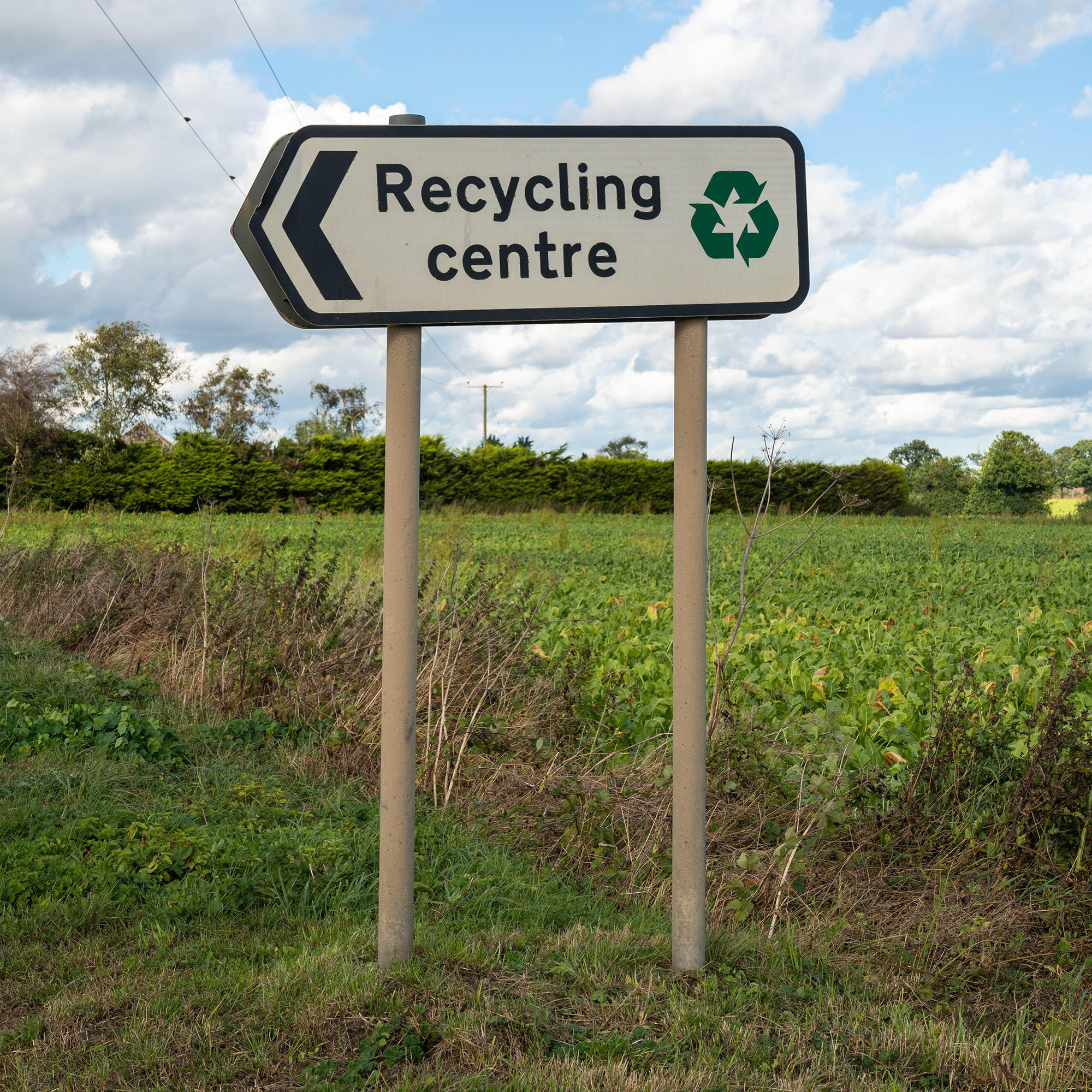 recycling centre sign by field