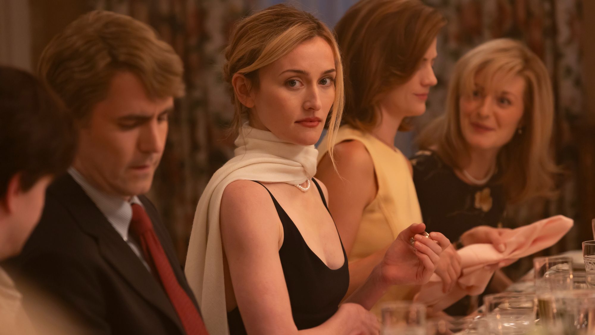 carolyn bessette kennedy in love story wearing a black dress and white scarf